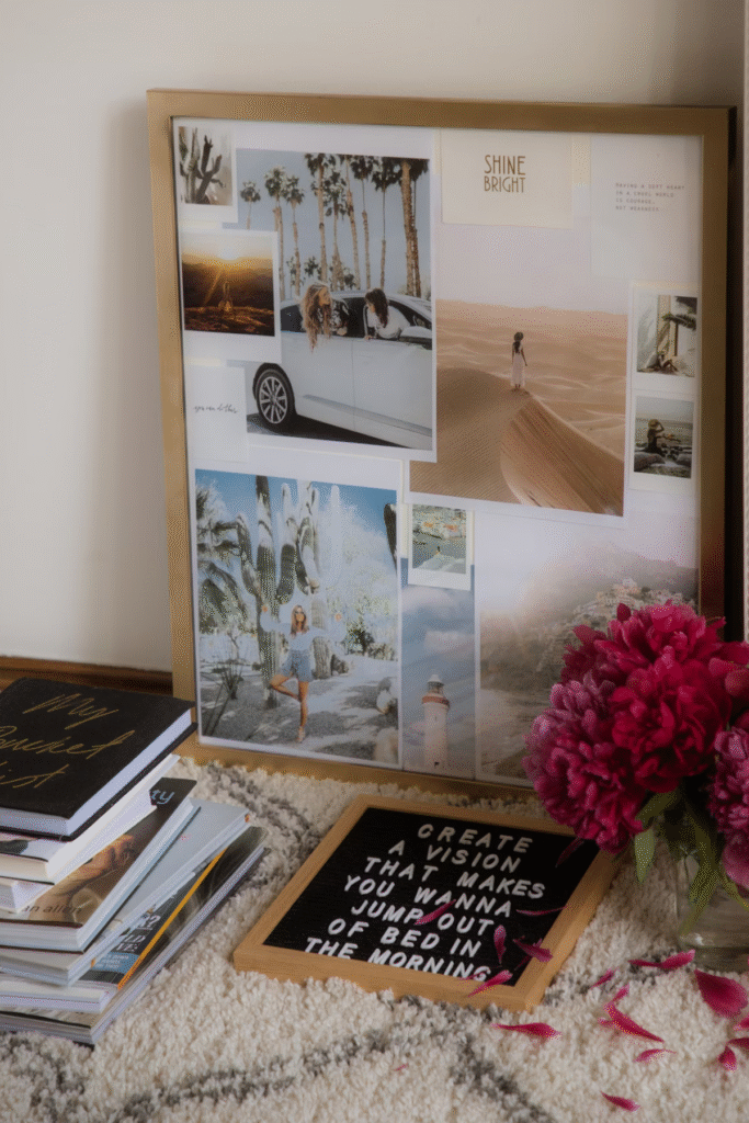 Framed vision board with travel photos, desert landscapes, palm trees, and "Shine Bright" quote displayed on textured rug with motivational letterboard and pink flowers