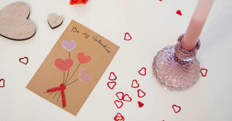 Valentines gift for boyfriend ideas including wrapped presents, romantic setup with roses and hearts